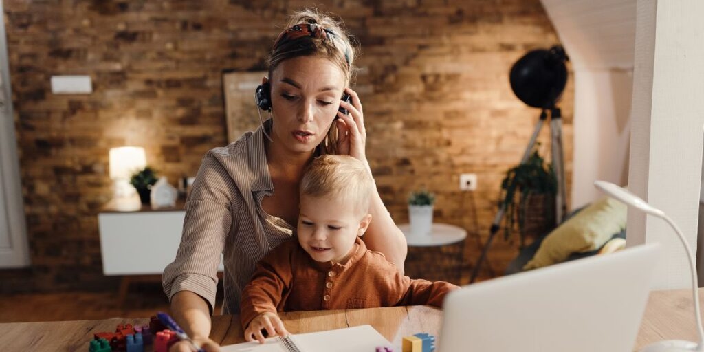 A mother works from home alongside her child.